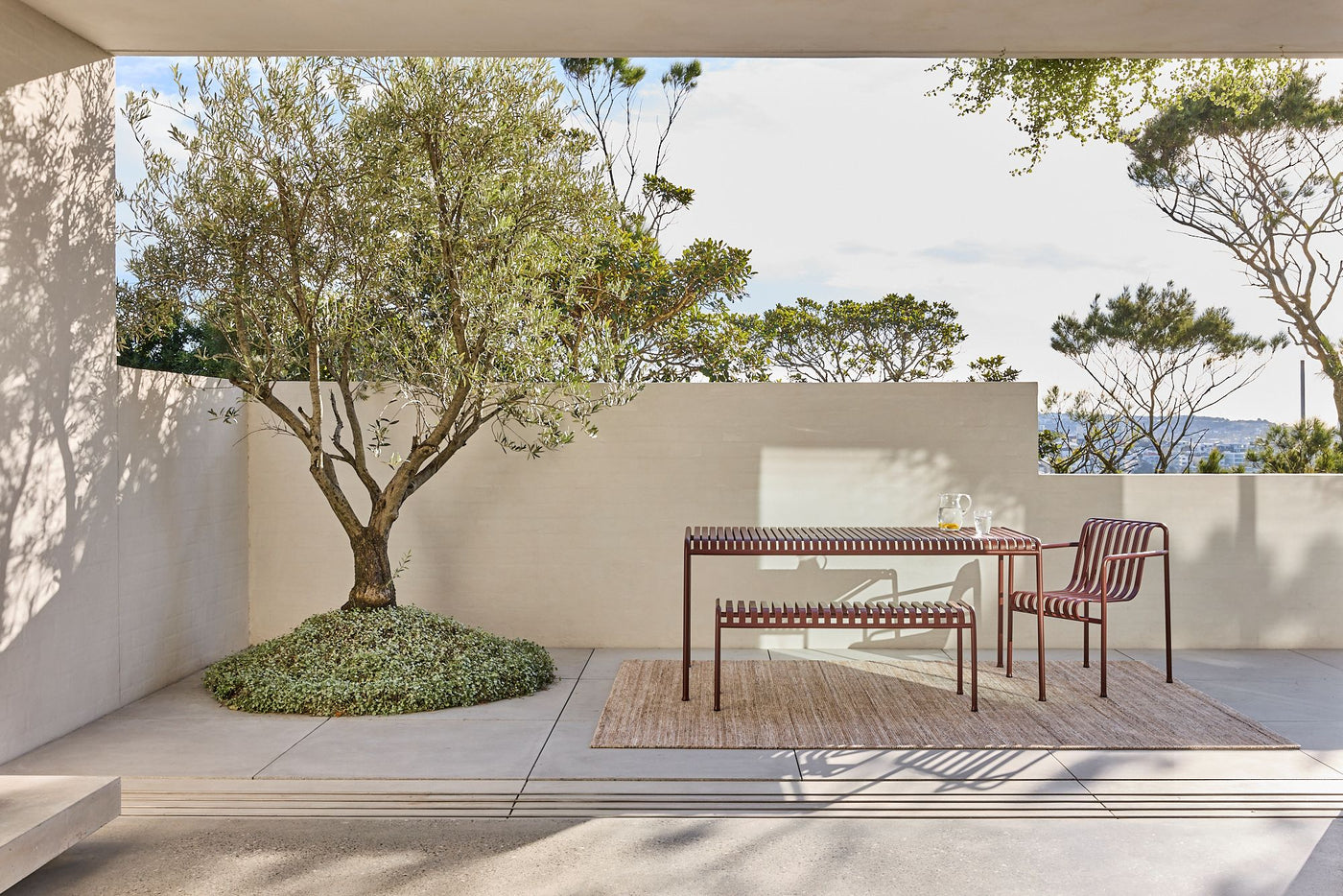 Location image of the Cove Linen outdoor rug by Designer Rugs, showing its handloom-knotted texture and subtle taupe tones that bring warmth and elegance to outdoor spaces.