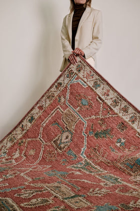location of the Biri rug from the Oushak Collection, featuring a red, cream and muted blue traditional pattern.