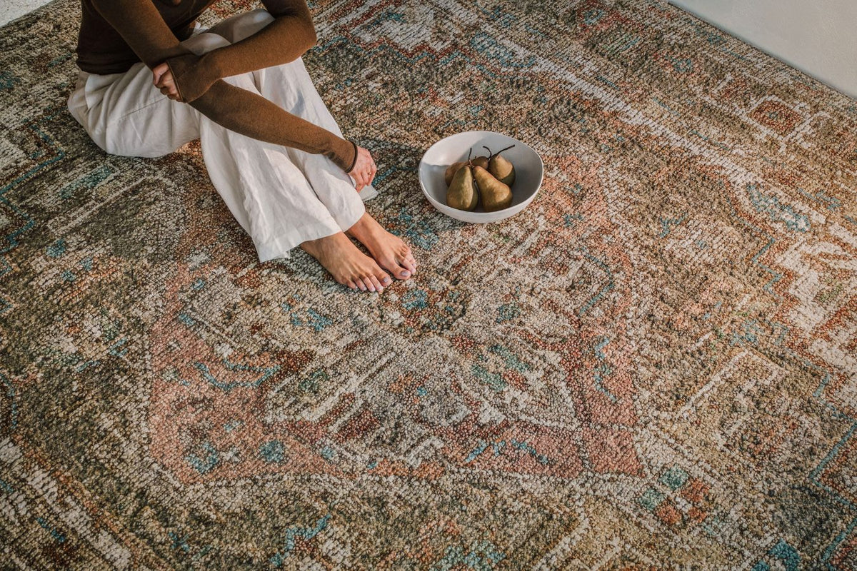 Close-up of the Zaman rug from the Oushak Collection, featuring a traditional pattern in olive, cream, terracotta and
