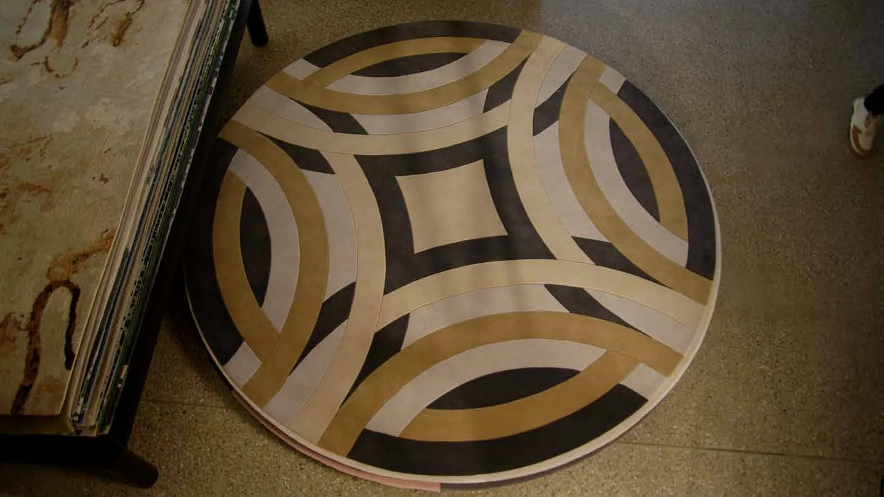 A round rug on a clean floor