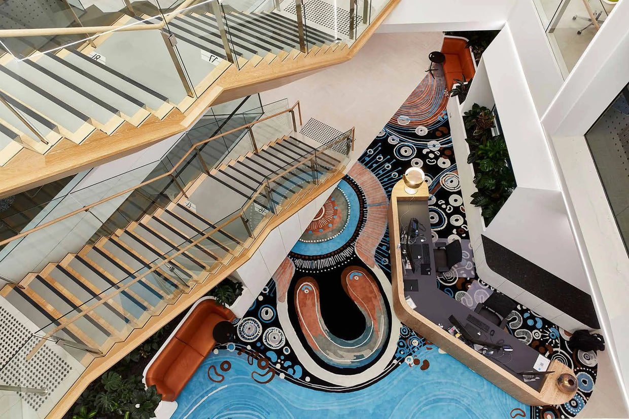 ANZ Sydney — custom rug beneath a sculptural staircase in a workplace interior