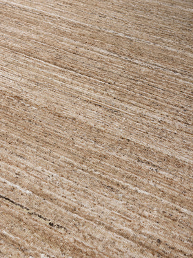 close up image of the Cove Taupe outdoor rug by Designer Rugs, showing its handloom-knotted texture and subtle linen tones that bring warmth and elegance to outdoor spaces.