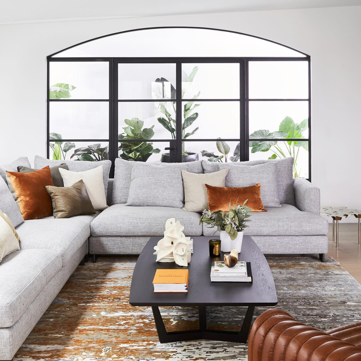 Living room view of distressed Aegean rug in gold colour