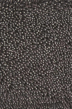 Close up view of textured Coral Shag rug in indigo colour