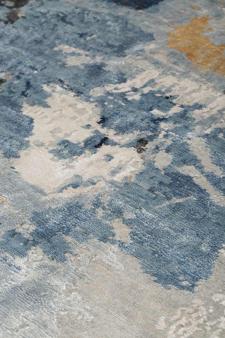 Close up image of blue handknot Salacia's Spring rug by Derry Tal