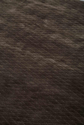 Close up view of textured Diamond Velour rug in dark brown colour