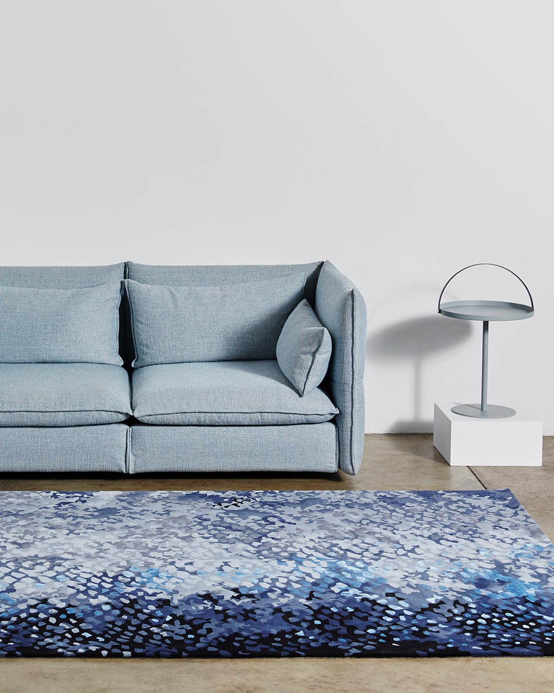 location shot of pisces rug by emma elizabeth designs blue fish scales