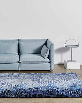 location shot of pisces rug by emma elizabeth designs blue fish scales