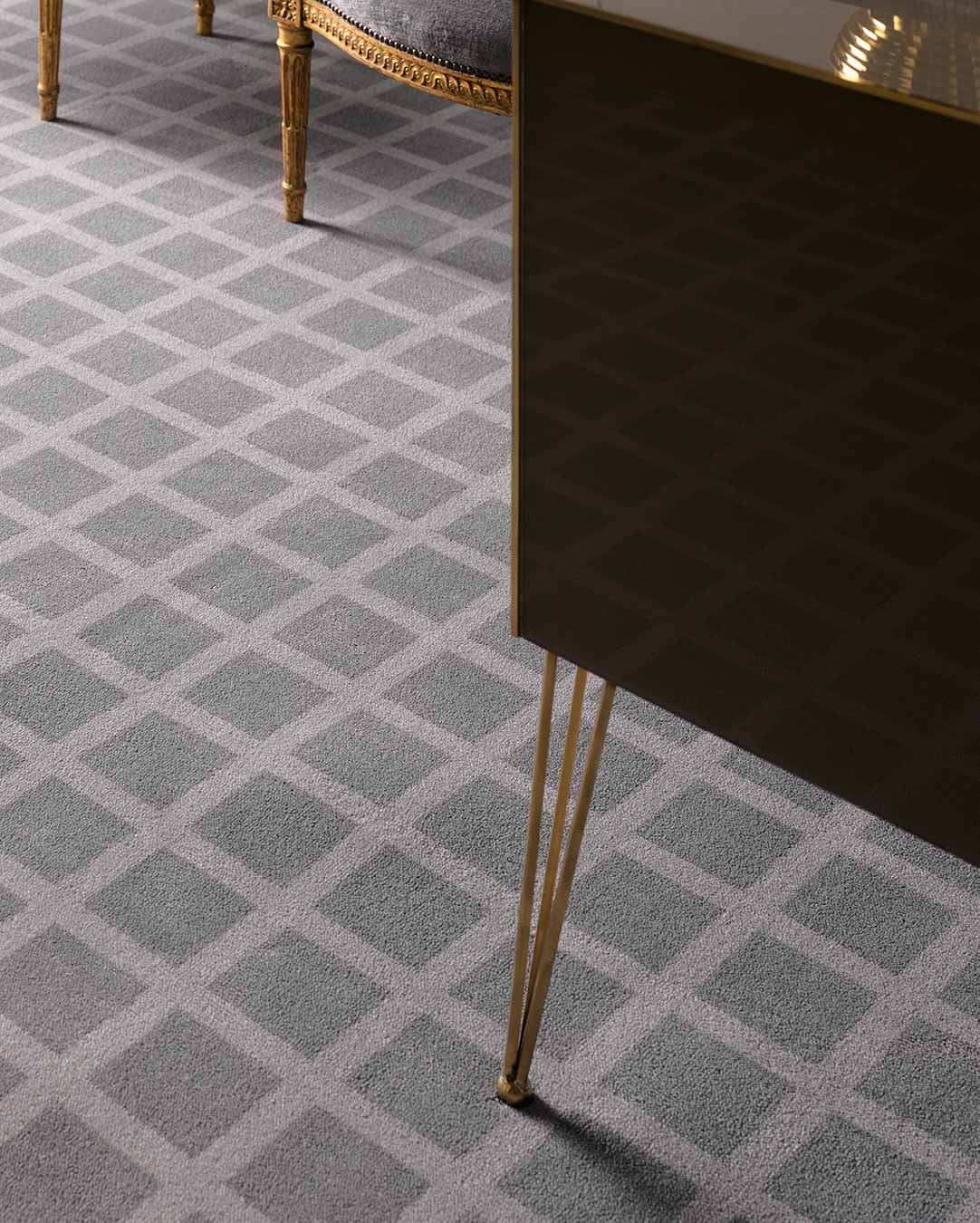 Close up view of Match grey geometric Axminster carpet by Greg Natale