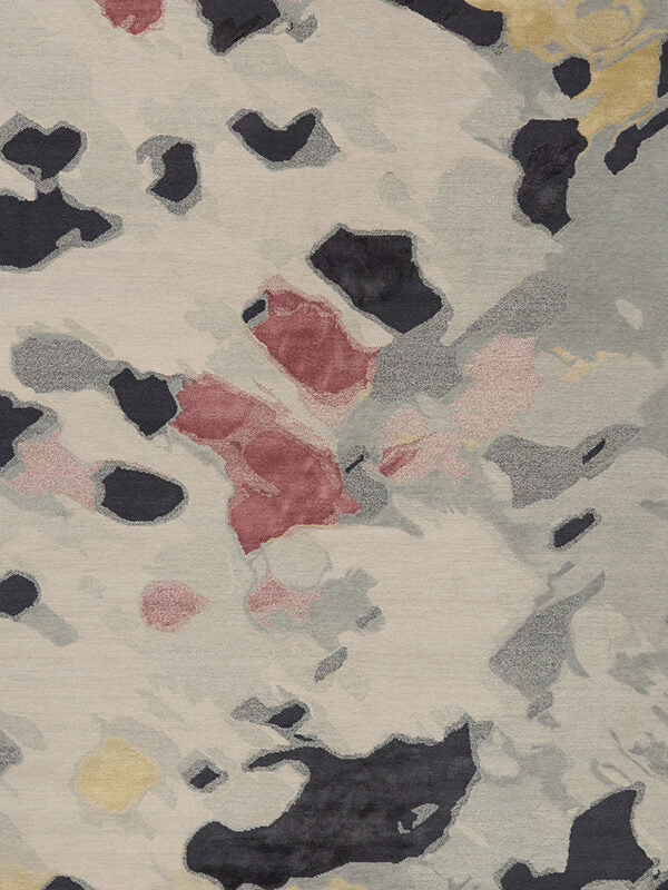 Overhead image of organic petale handknot rug by Hare and Klein in pink, beige , charcoal and yellow