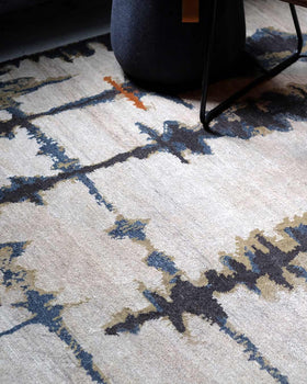 Detailed image of abstract Inlets handknot rug by Hare and Klein in beige colour