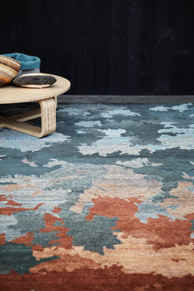 Styled image of organic Shadows handknot rug by Hare and Klein in blue colour