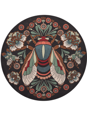 A circular black rug featuring a highly detailed, symmetrical vintage-style illustration of a large striped moth in the center, surrounded by floral motifs and smaller insects in muted teal, rust red, cream, and brown.