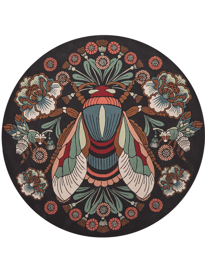 A circular black rug featuring a highly detailed, symmetrical vintage-style illustration of a large striped moth in the center, surrounded by floral motifs and smaller insects in muted teal, rust red, cream, and brown.