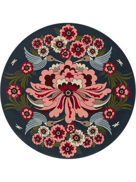 A round area rug featuring a symmetrical, traditional floral and bird pattern on a dark navy blue background. The design includes a large pink and red central flower, smaller matching flowers around the border, green leaves, and stylized birds in light blue-gray.