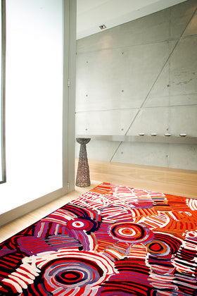 Overhead image of indigenous Celebration rug by Minnie Pwerle in pink colour