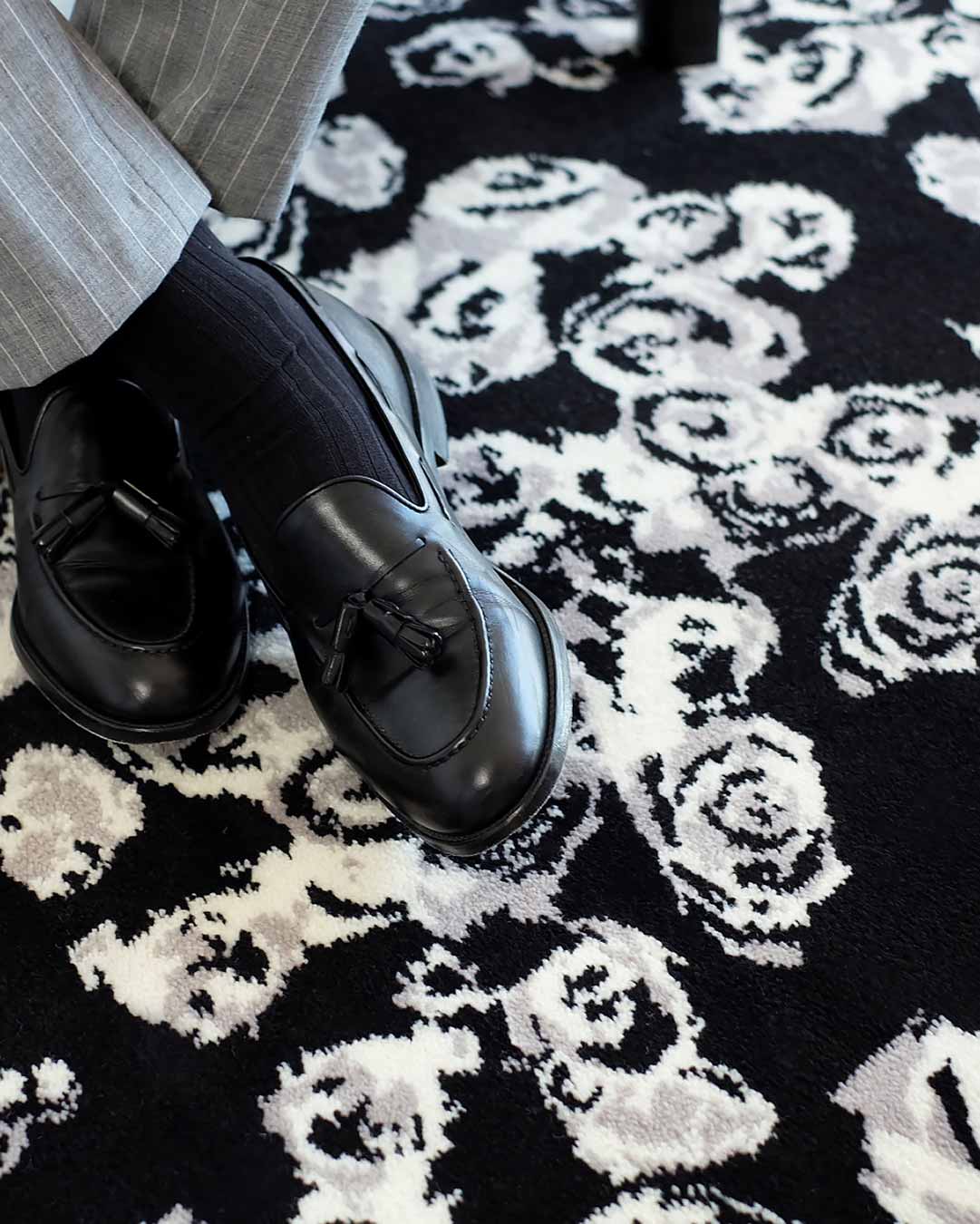 Close up image of Iona black and white floral Axminster carpet