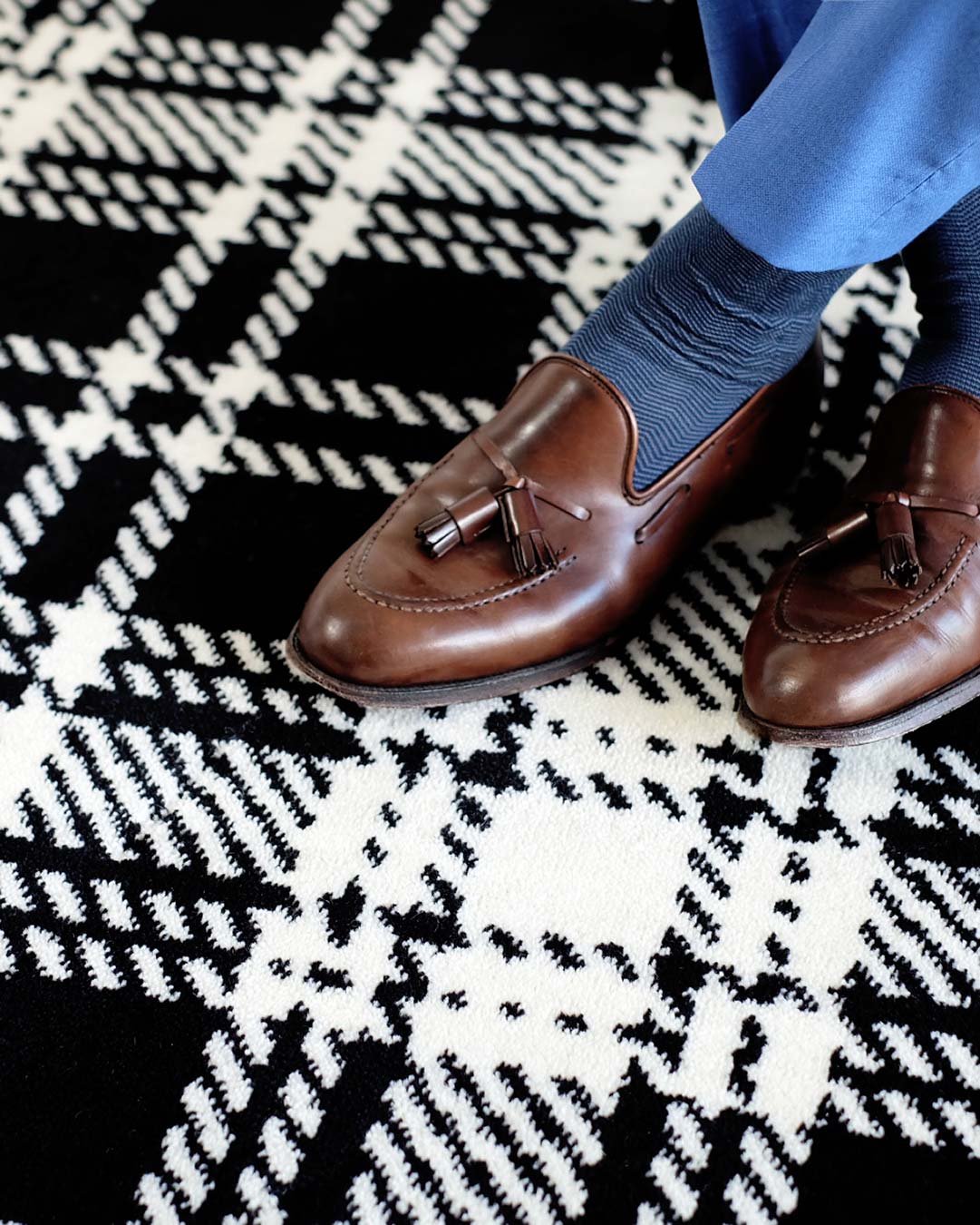 Close up view of Kintore black and white tartan Axminster carpet