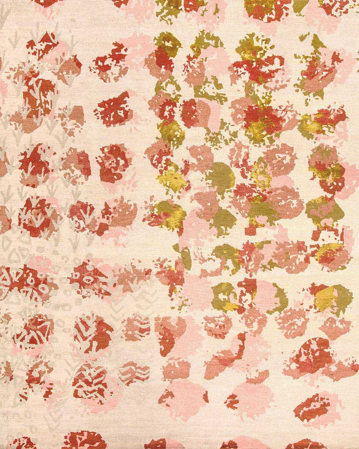 A close-up of a textured fabric or wallpaper pattern featuring abstract floral motifs in shades of terracotta red, dusty pink, and olive green on a warm cream background.