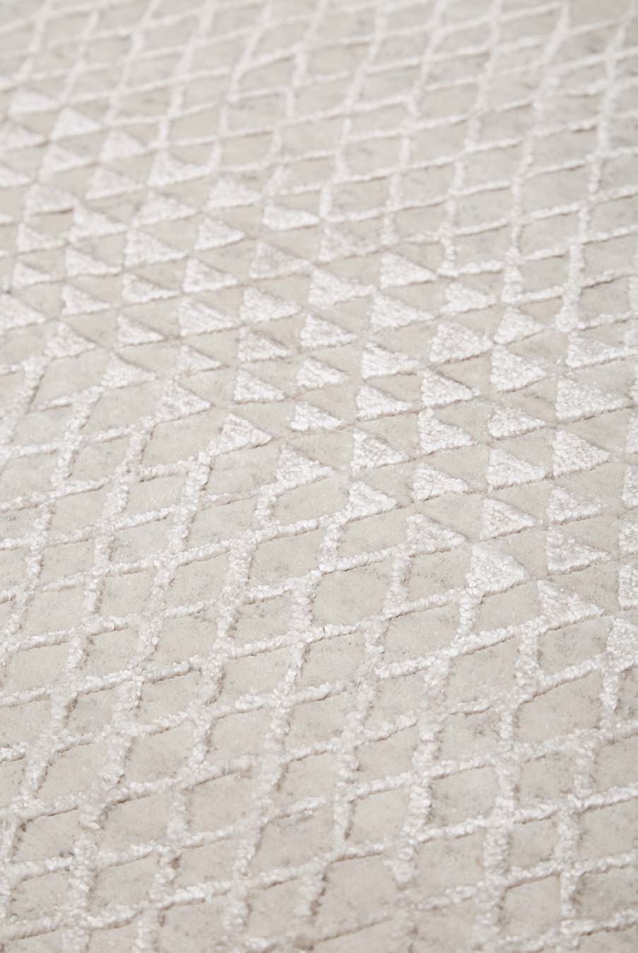 Detailed view of patterned Rattan rug in silver colour