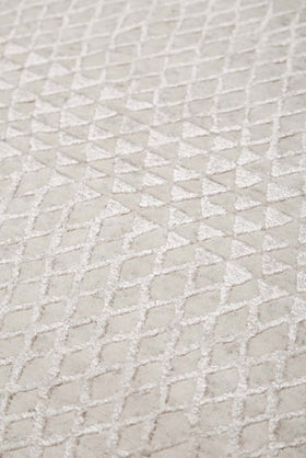 Detailed view of patterned Rattan rug in silver colour