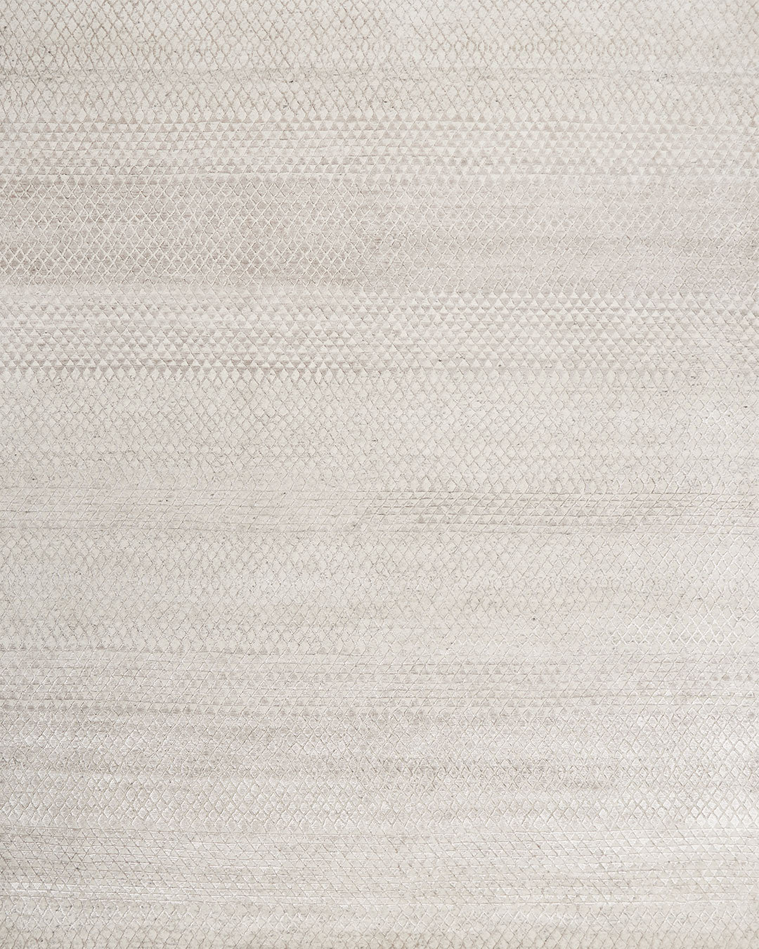 Overhead view of patterned Rattan rug in silver colour