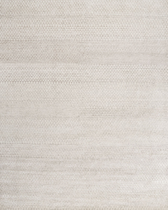 Overhead view of patterned Rattan rug in silver colour