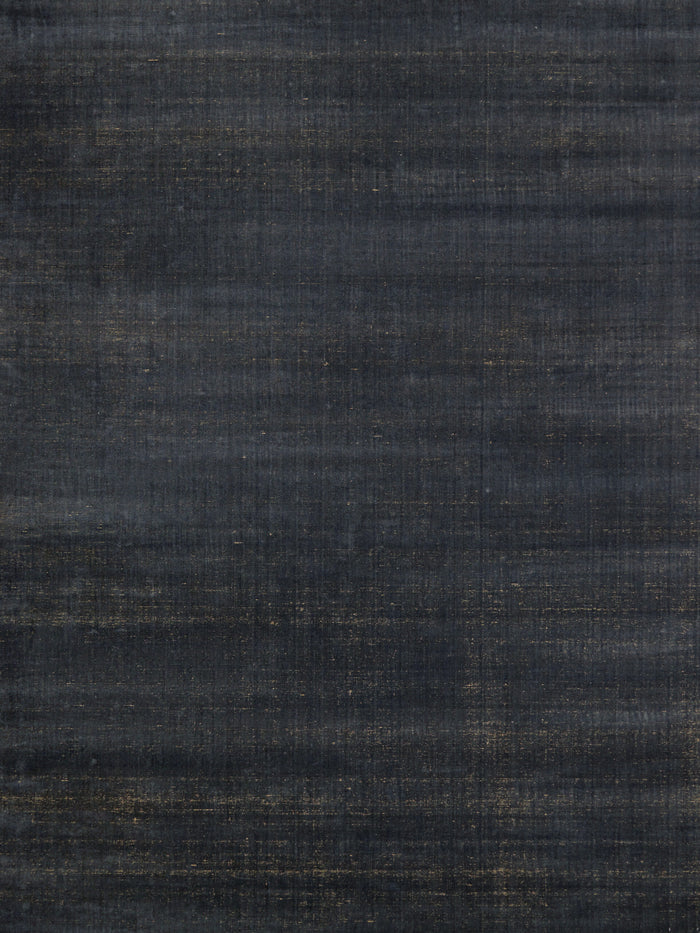 overhead image of the Ravira-charcoal-Honey rug