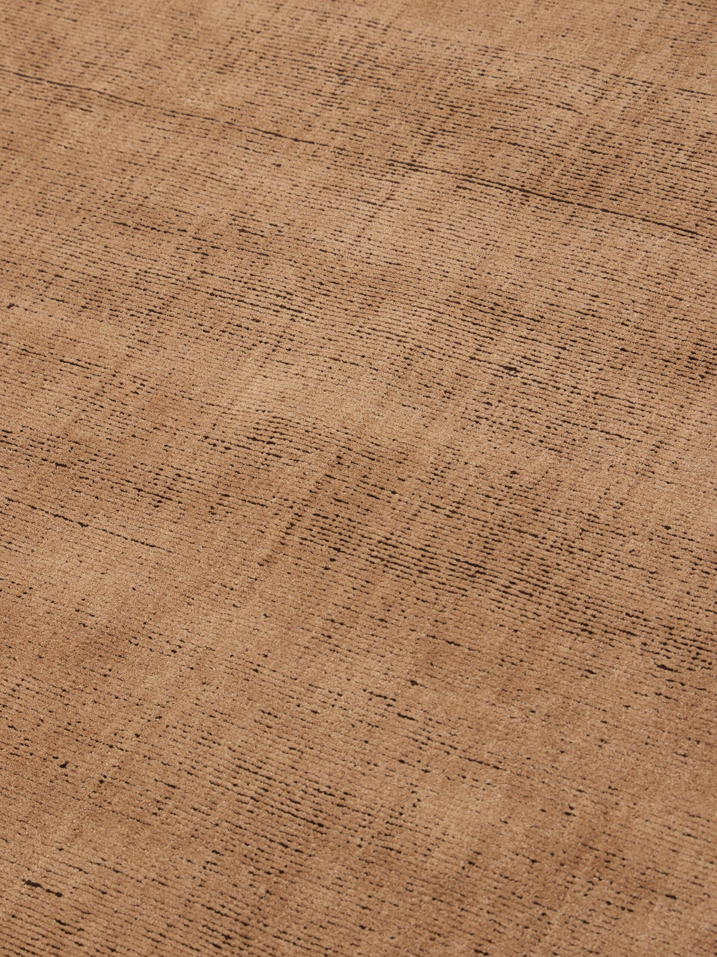 close up image of the Ravira peach coffee rug