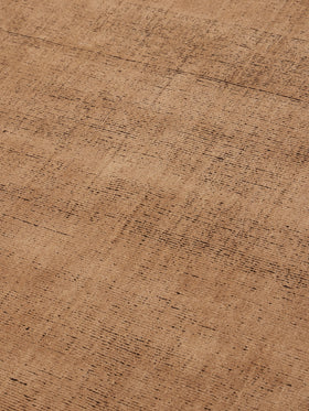 close up image of the Ravira peach coffee rug