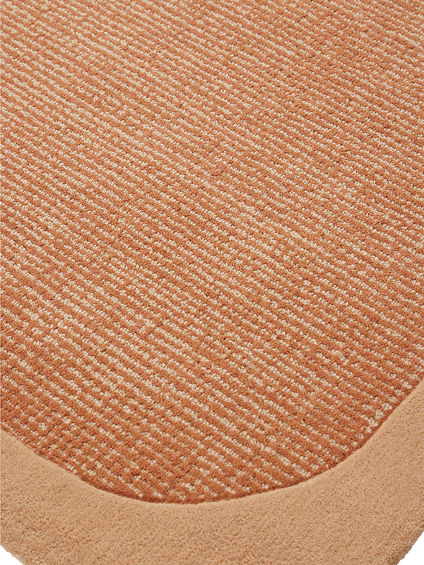 Close up image of the wolfram fudge rug with border