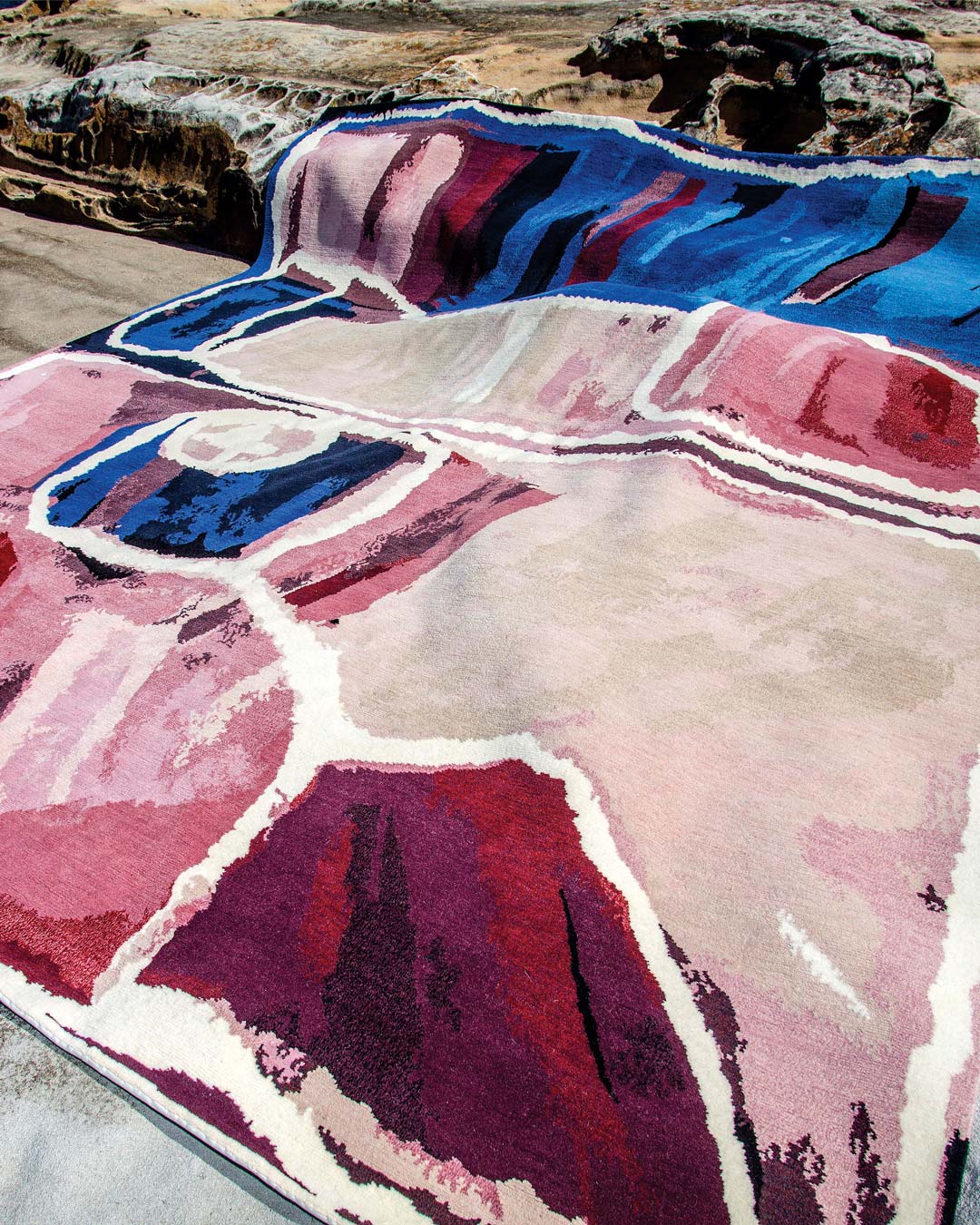 Indigenous rug Kirriwirri in blue and pink colour in a coastal setting