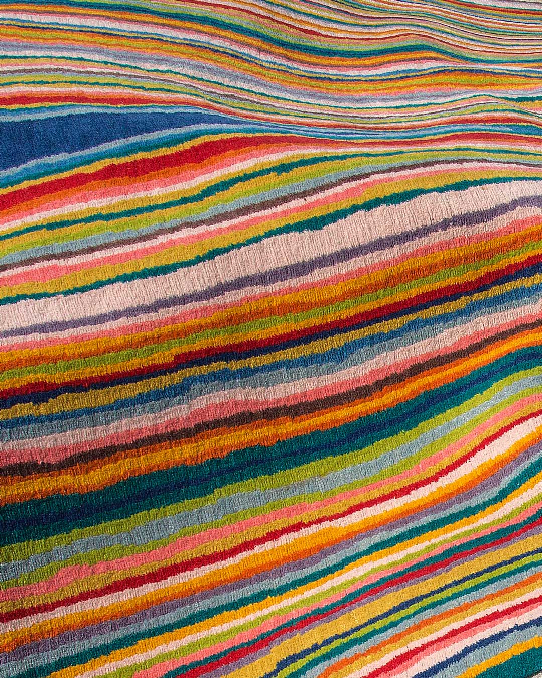 Detailed view of indigenous Untitled 2006 rug in rainbow colours