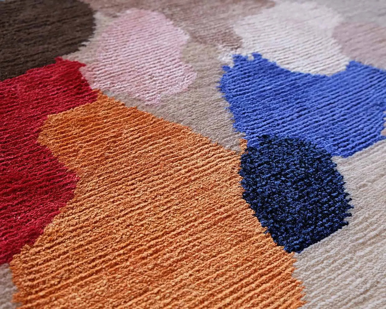 Silk pile in blue, red and orange blocks