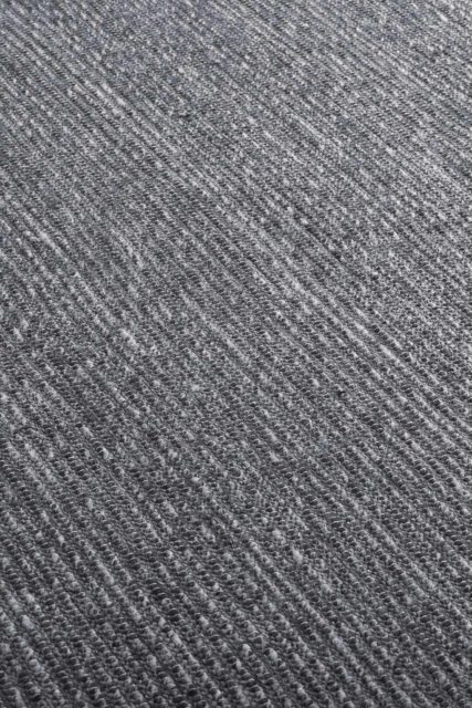 Close up view of textured Stylo rug in dark grey colour