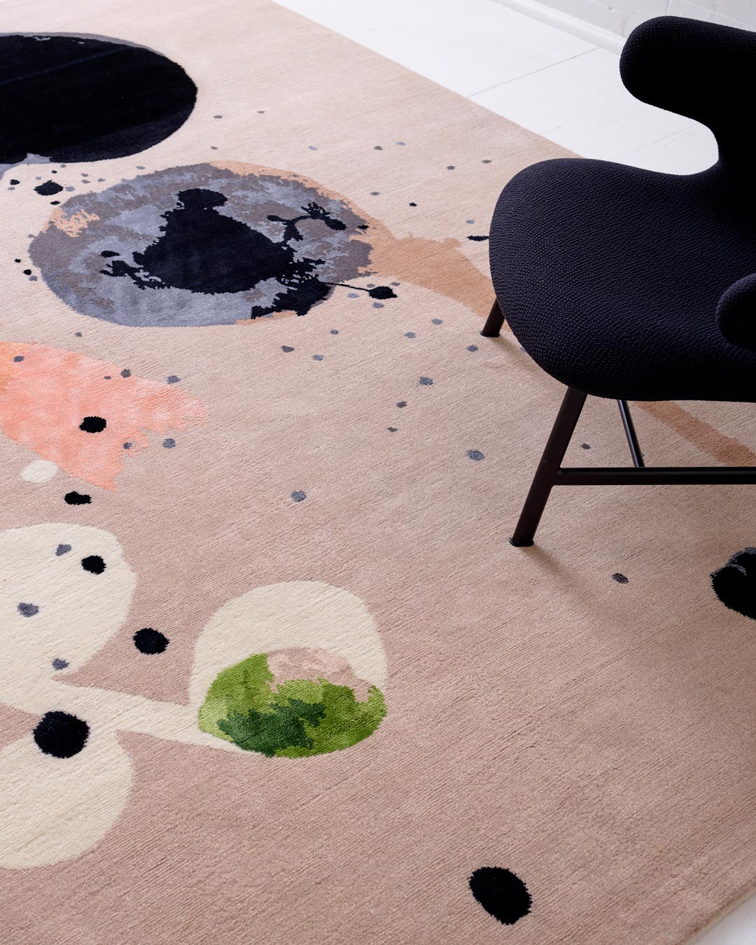Close up image of painterly Seed Pod rug by Louise Olsen in grey colour