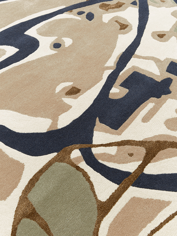 Close up image of floral Tindal rug in beige colour