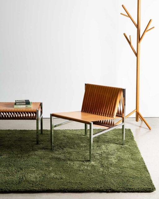 Living room view of textured Napoleon Shag rug in olive green colour